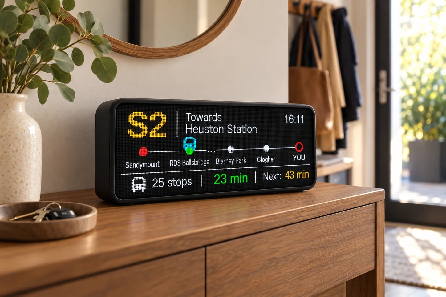 RideDot Home on a hallway console beside keys, ready to glance at on the way out